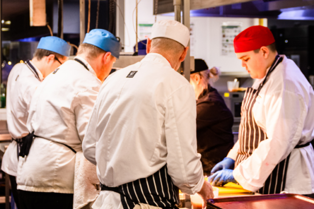 Catering and Hospitality students making food in the kitchen for National Apprenticeship Week 2022 Celebration.