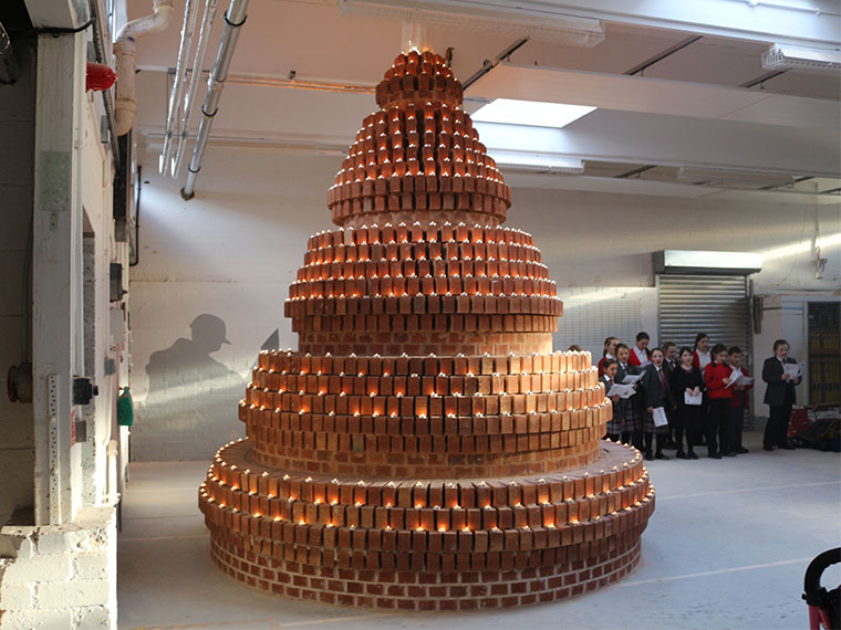 Completed Brick Christmas tree lit by nearly 2000 candles