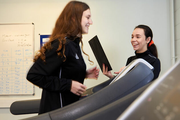 A Sport student running on a treadmill.