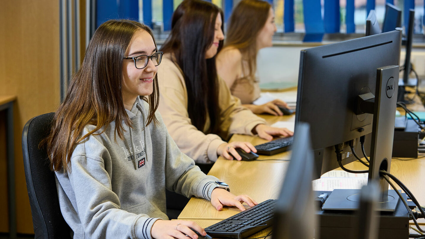 Students sat at computers