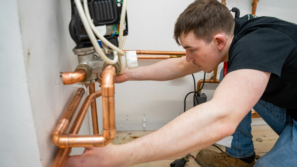 A plumbing student in the workshop at North Notts College