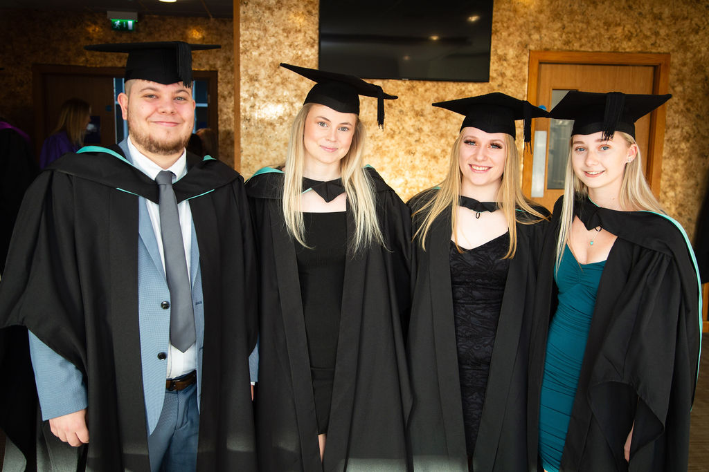 Students posing for photos after the graduation ceremony