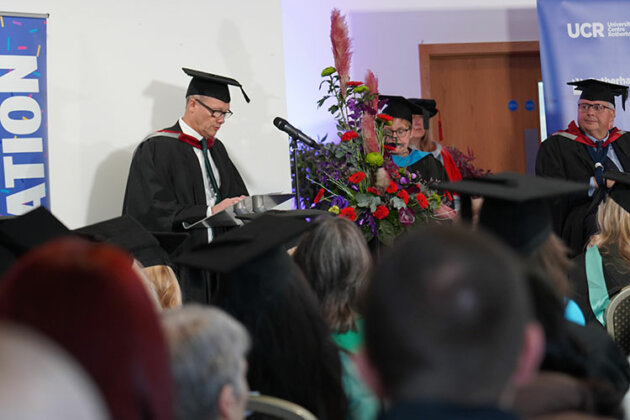 Jason Austin, CEO and Principal of the RNN Group, making a speech during the graduation ceremony